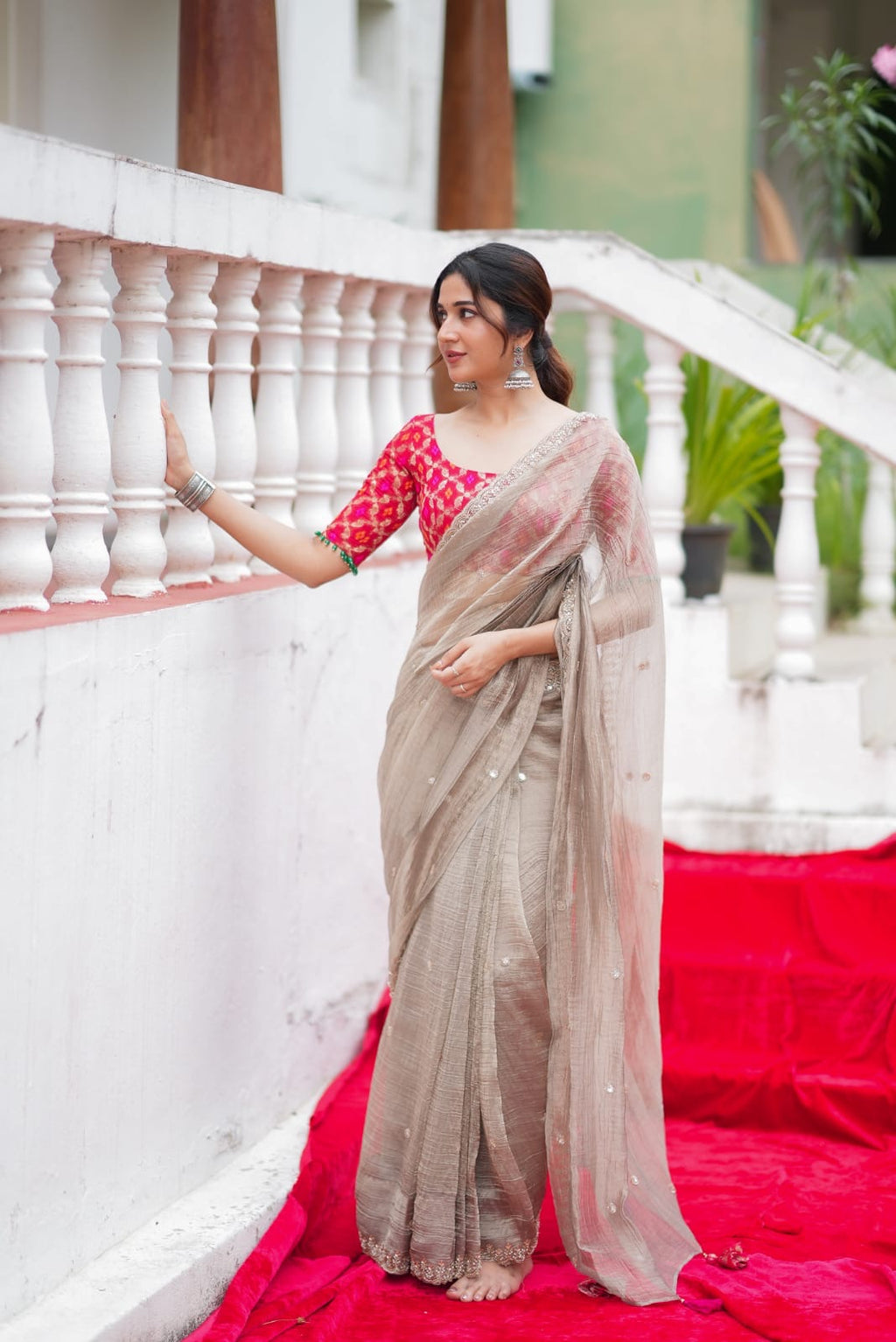 Grey tissue saree with red banarasi blouse