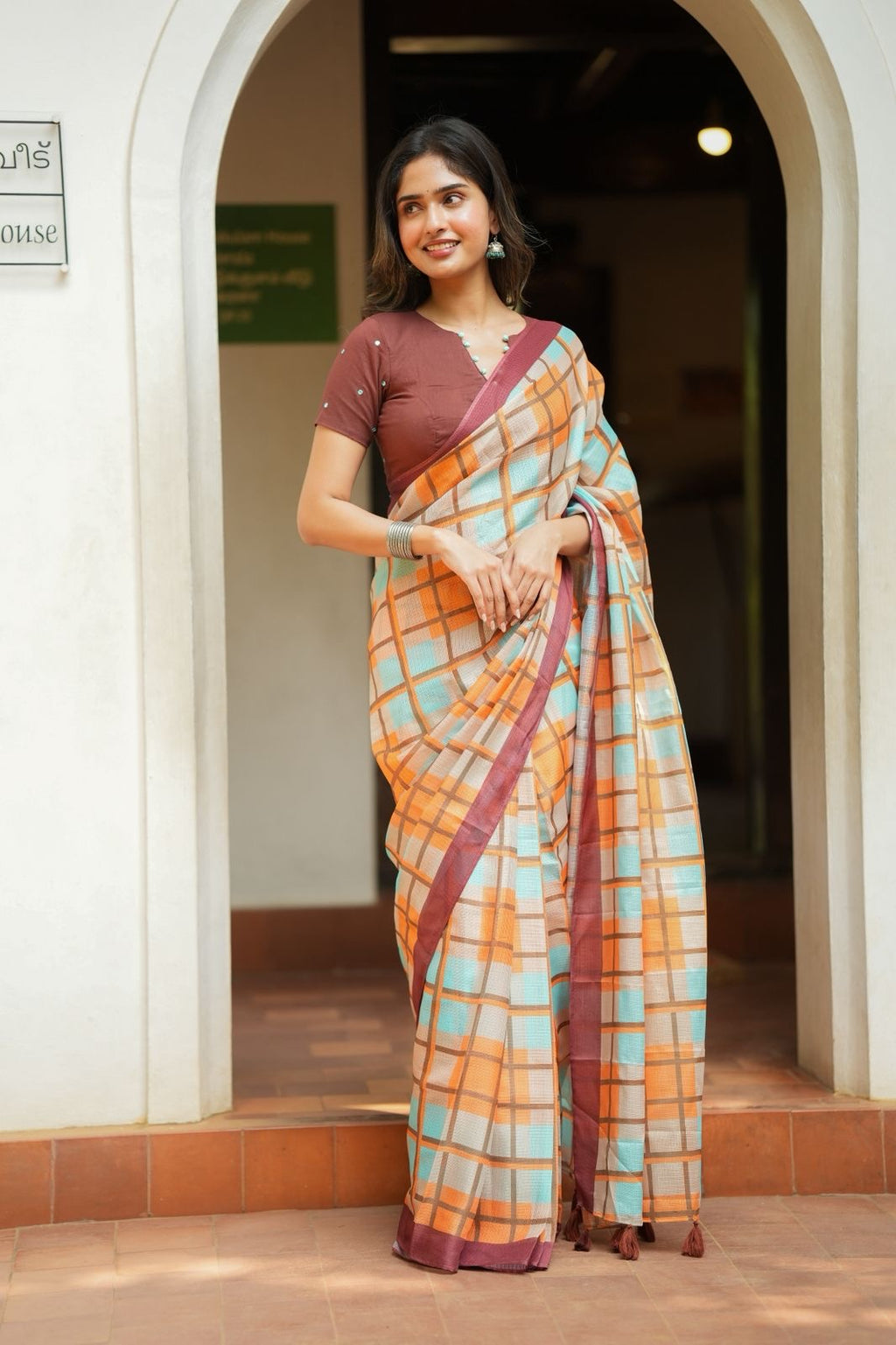 Multi checked kota saree with brown embroidery blouse
