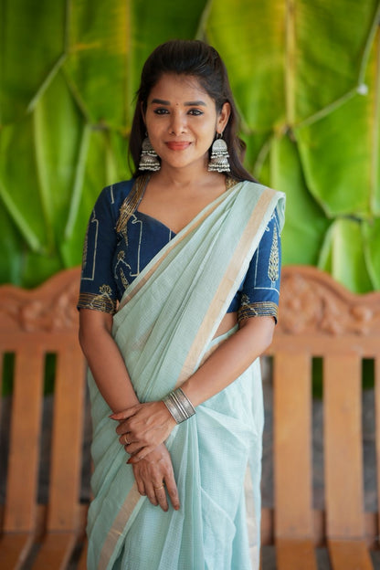 Aqua blue kota doria saree with hand work blouse