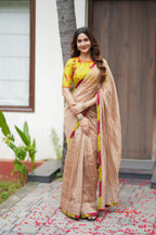 Antique gold tissue saree with parrot handwork blouse
