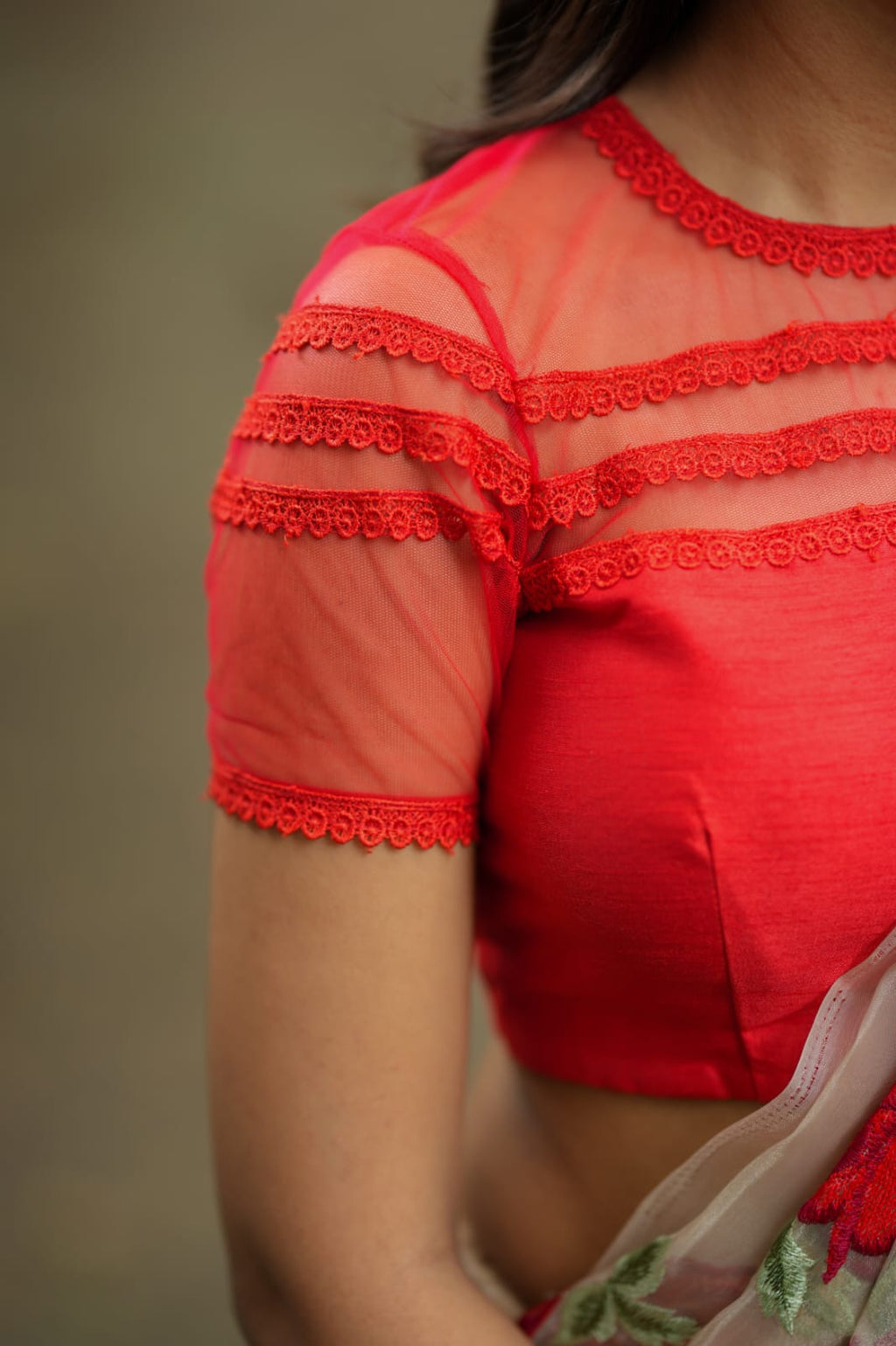 Glossy organza saree with red embroidery blouse
