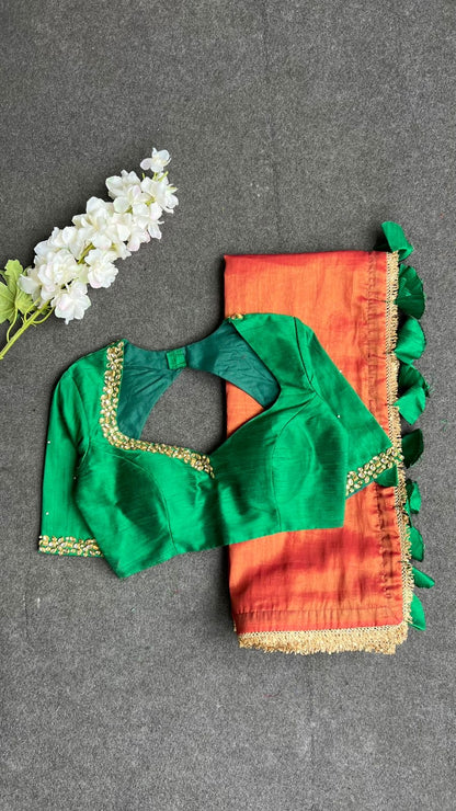 Red tissue saree with green hand work blouse