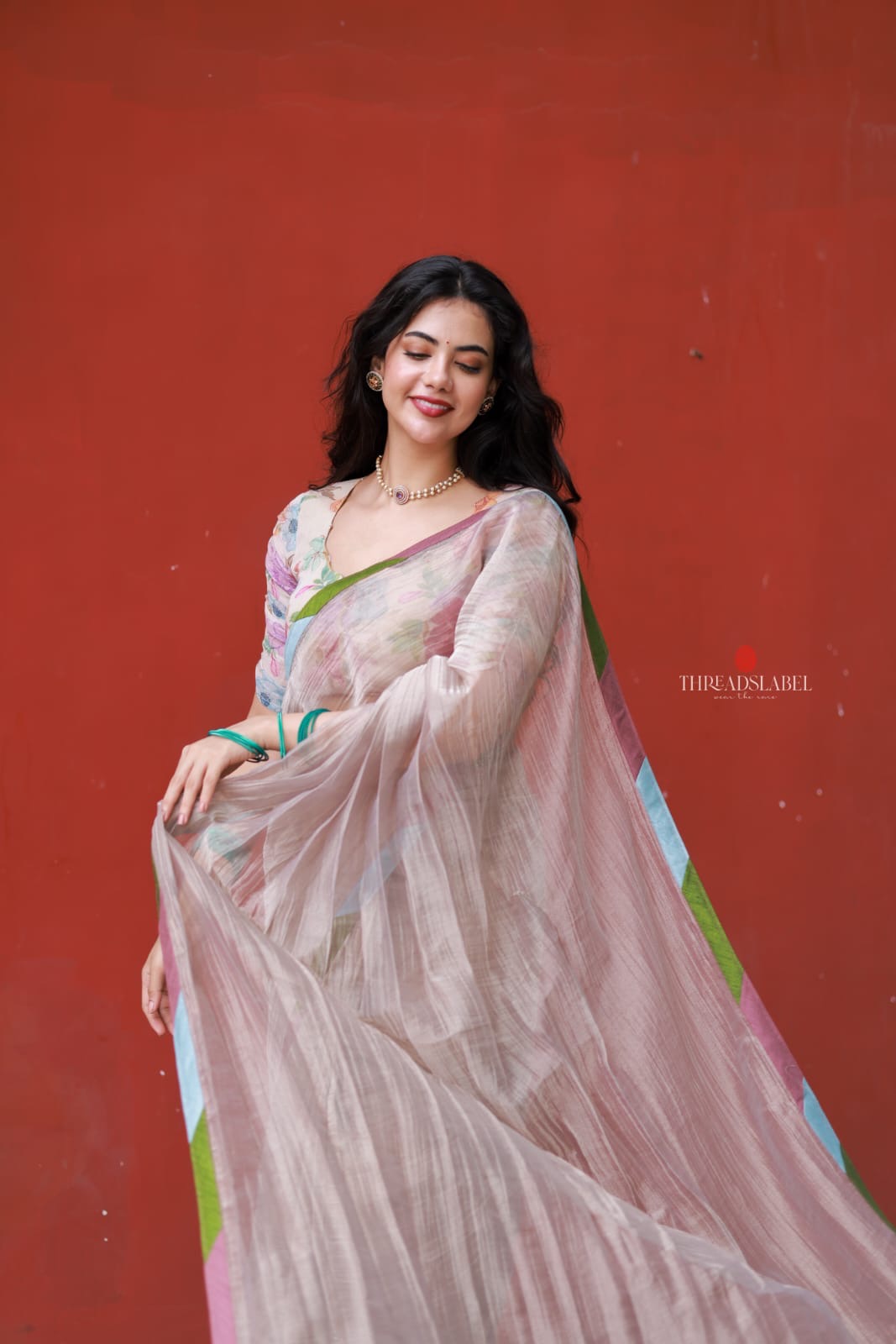 Dusty silver tissue saree with pearl hand work blouse