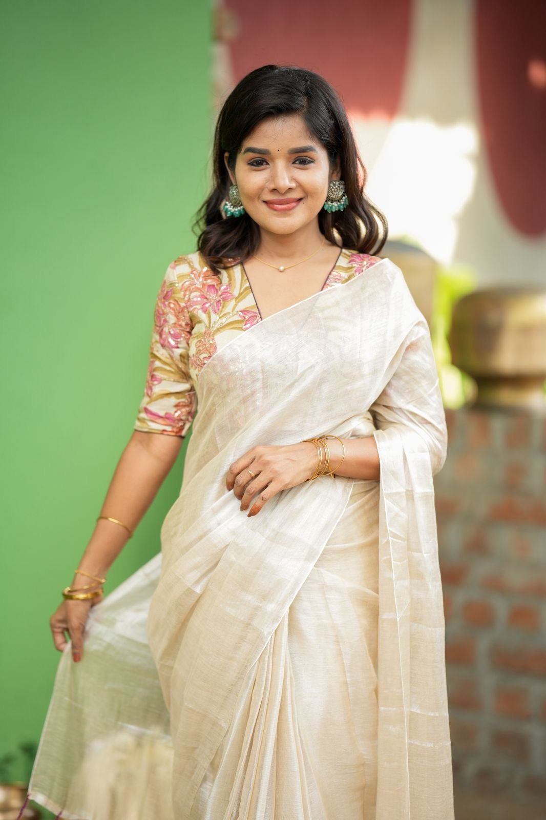 Cream soft tissue saree with embroidered blouse