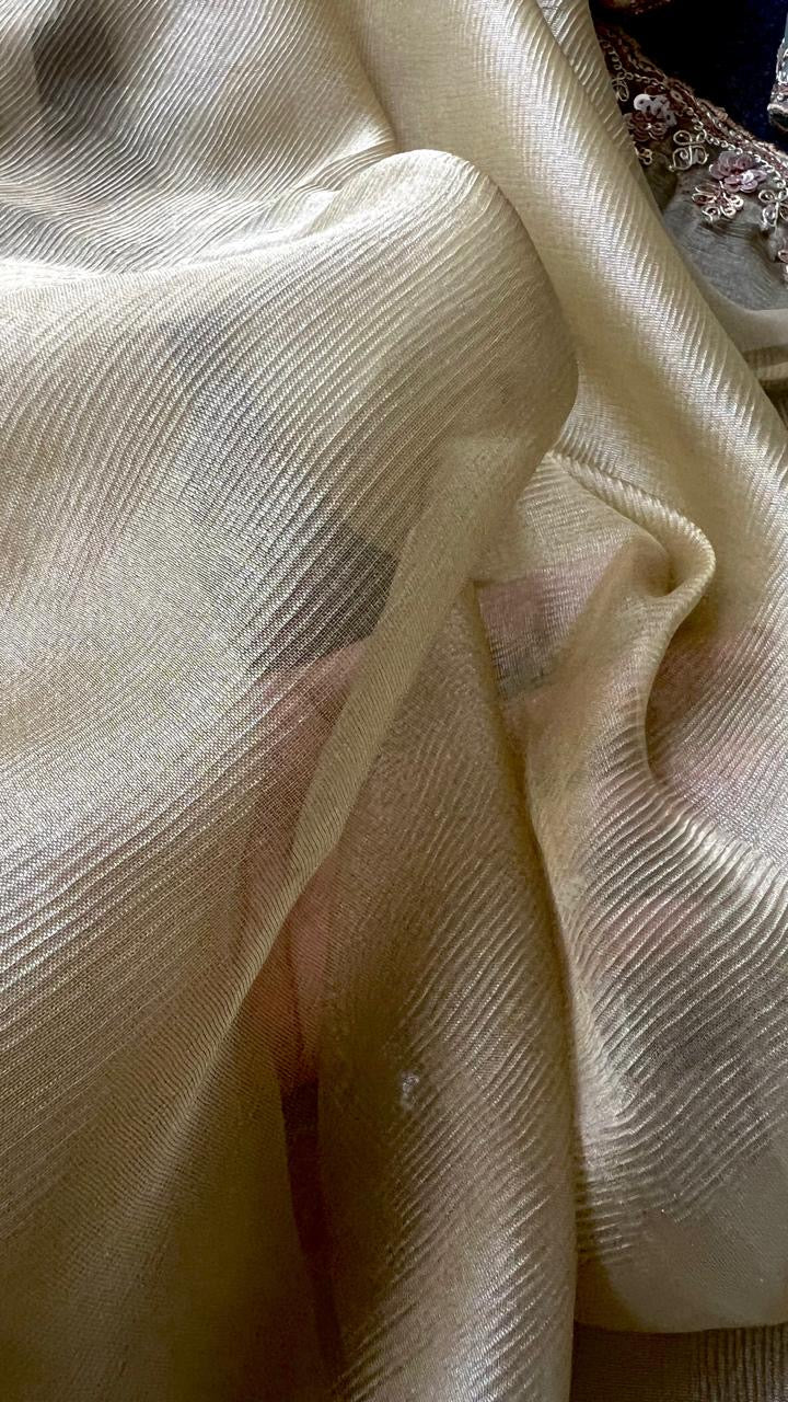 Golden soft tissue saree with blue floral embroidery blouse