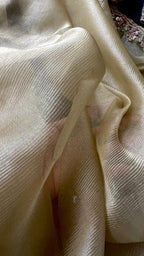 Golden soft tissue saree with blue floral embroidery blouse