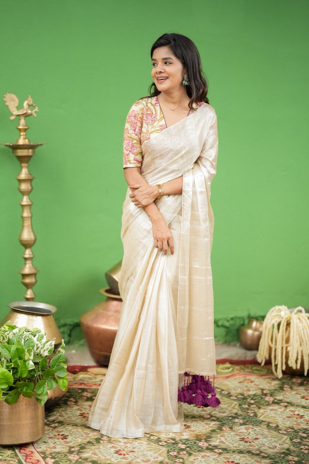 Cream soft tissue saree with embroidered blouse