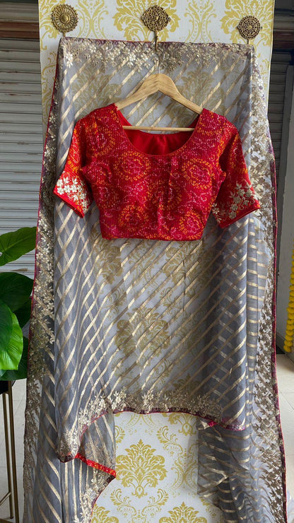 Striped grey organza saree with chiffon embroidery blouse - Threads
