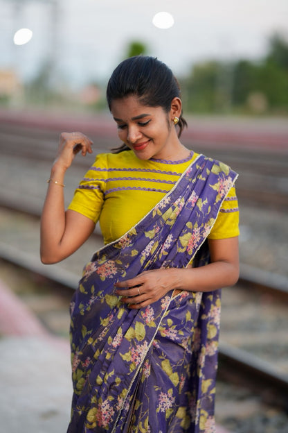 Blue floral tissue saree with lime hand work blouse