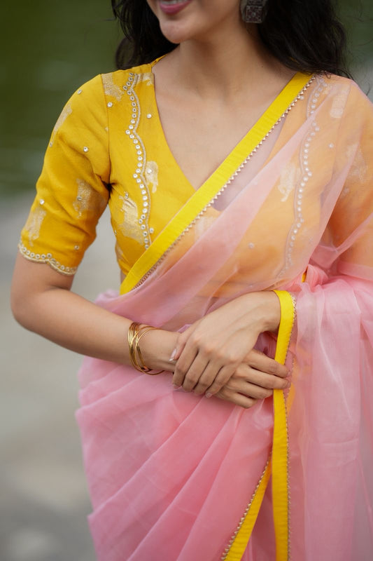 Peach organza saree with yellow hand work blouse