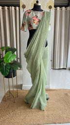 Light green tissue saree with mirror floral blouse