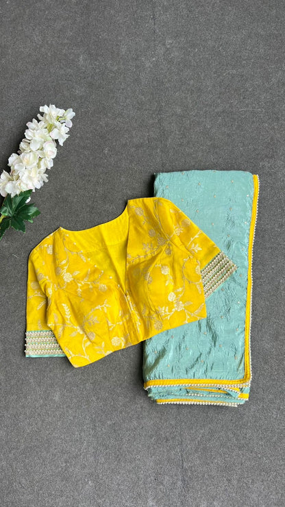 Blue glass tissue saree with yellow banarasi blouse