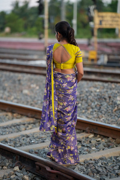 Blue floral tissue saree with lime hand work blouse