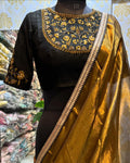 Gold tissue saree with black hand worked blouse