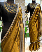 Gold tissue saree with black hand worked blouse