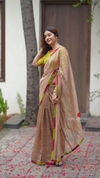 Antique gold tissue saree with parrot handwork blouse