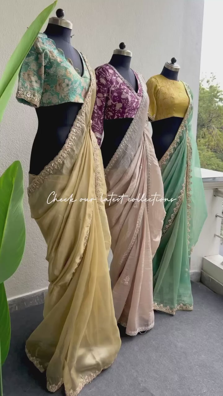 Golden soft tissue saree with blue floral embroidery blouse