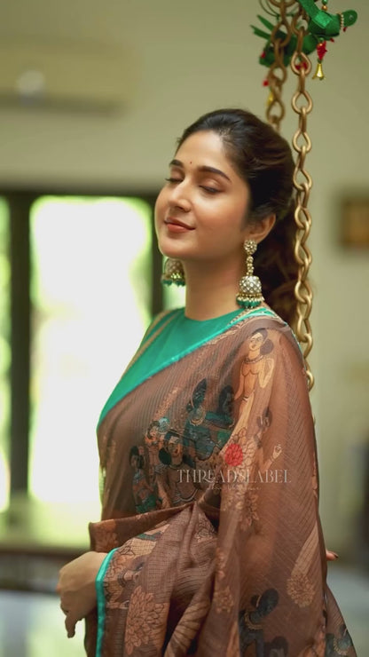 Brown kalamkari kota saree with blue hand work blouse