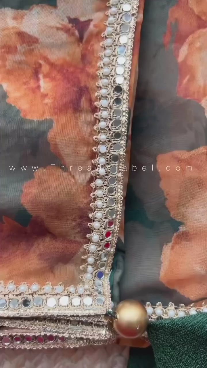 Bottle green floral organza saree with hand worked blouse