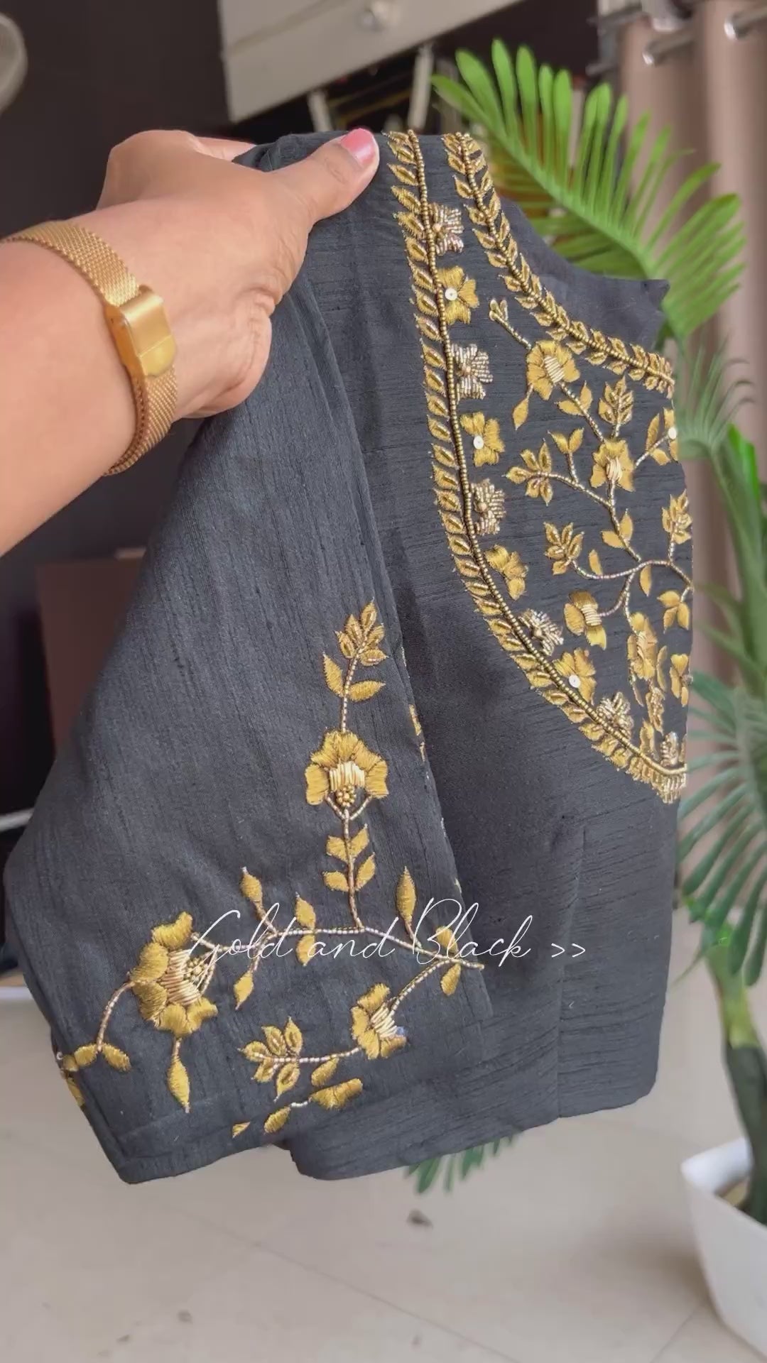 Gold tissue saree with black hand worked blouse
