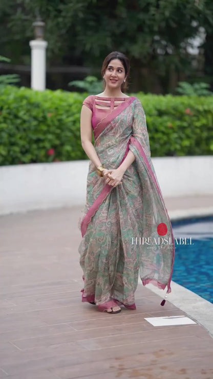 Jade green viscose jute saree with pink tissue blouse