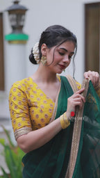 Green organza saree with yellow hand work blouse