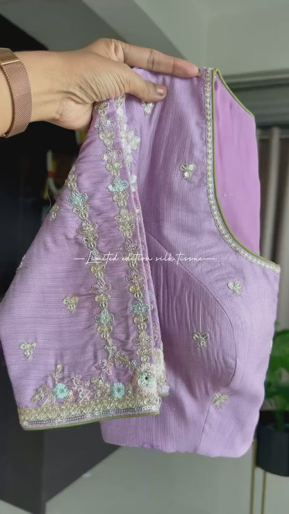 Green tissue saree with lavender embroidered blouse