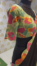 Black georgette saree with floral cotton blouse