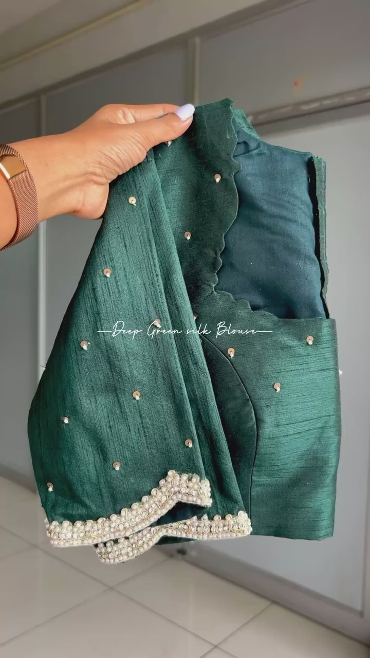 Half white floral kossa saree with green hand worked blouse