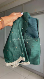 Half white floral kossa saree with green hand worked blouse