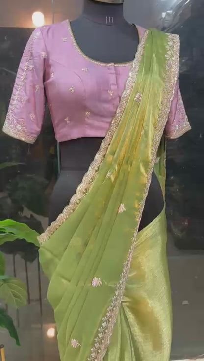 Green tissue saree with lavender embroidered blouse