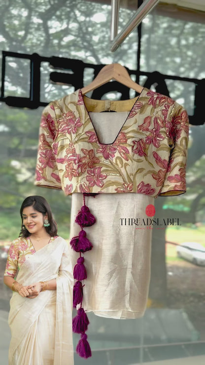 Cream soft tissue saree with embroidered blouse