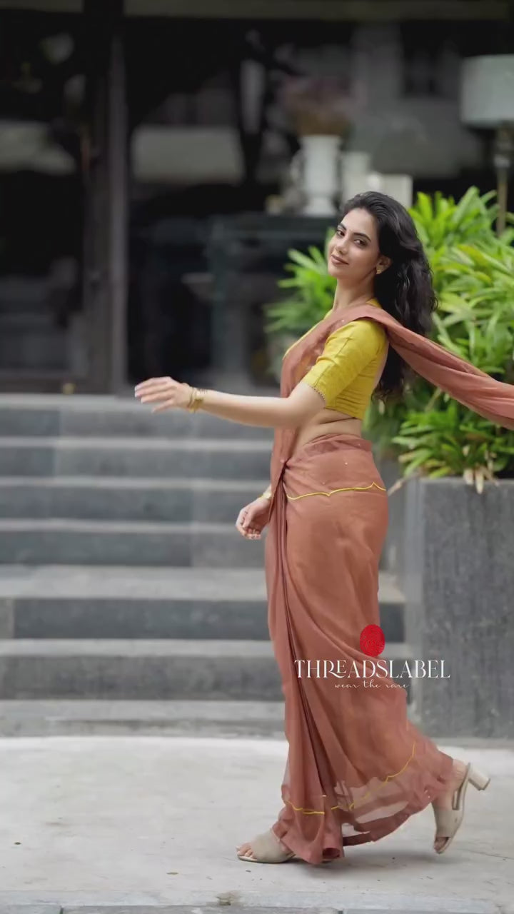 Brown soft organza saree with lime green ikkat blouse