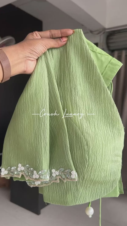 Green crushed tissue saree with hand worked blouse