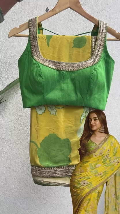 Yellow viscose saree with green silk embroidered blouse