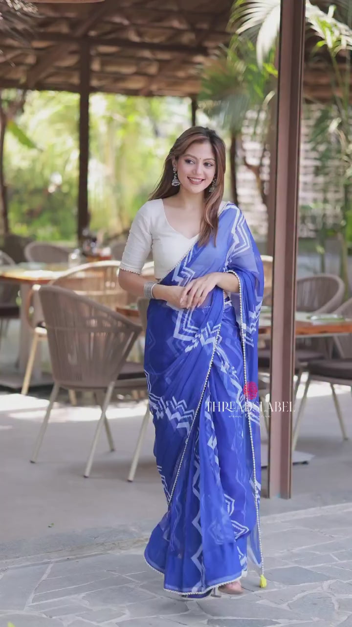 Blue chiffon saree with white embroidery blouse