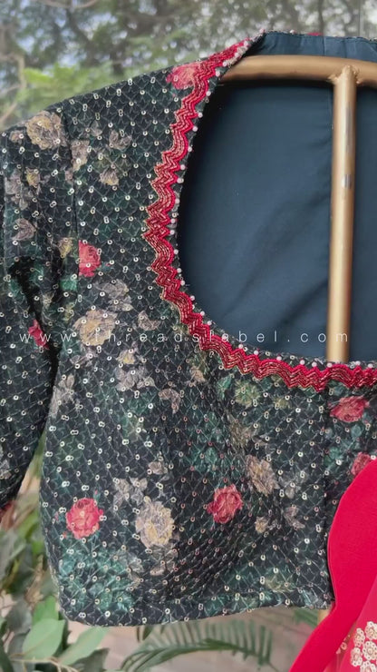 Red organza saree with greenish black handwork blouse