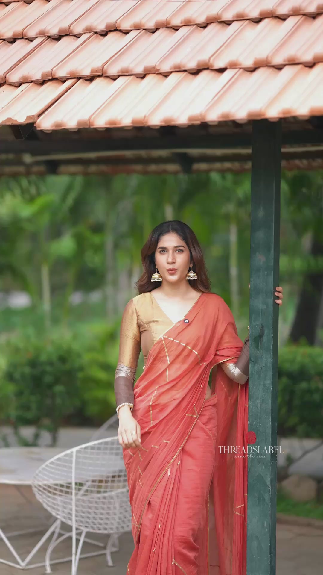 Orange rust saree with tissue handwork blouse