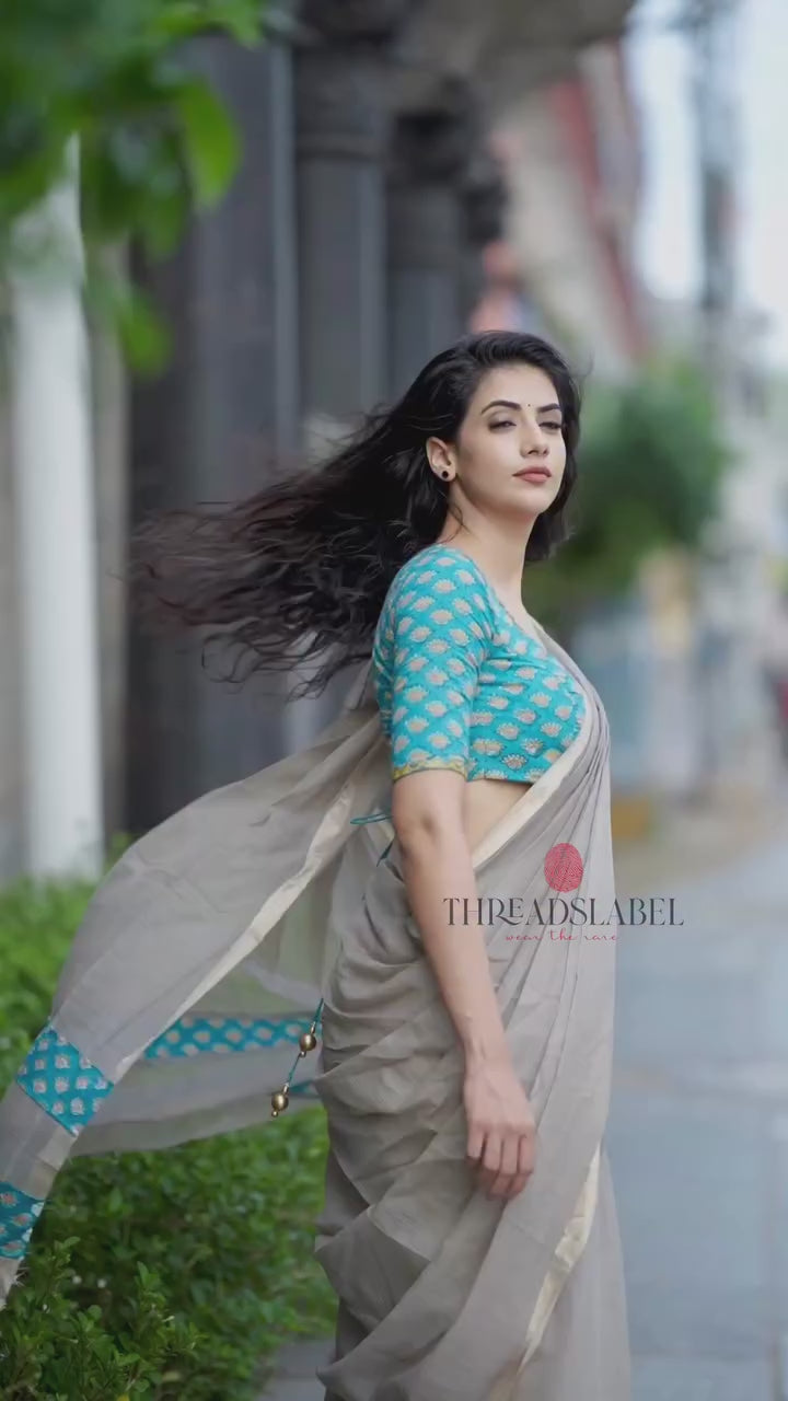 Light peach mul kota saree with yellow hand work blouse