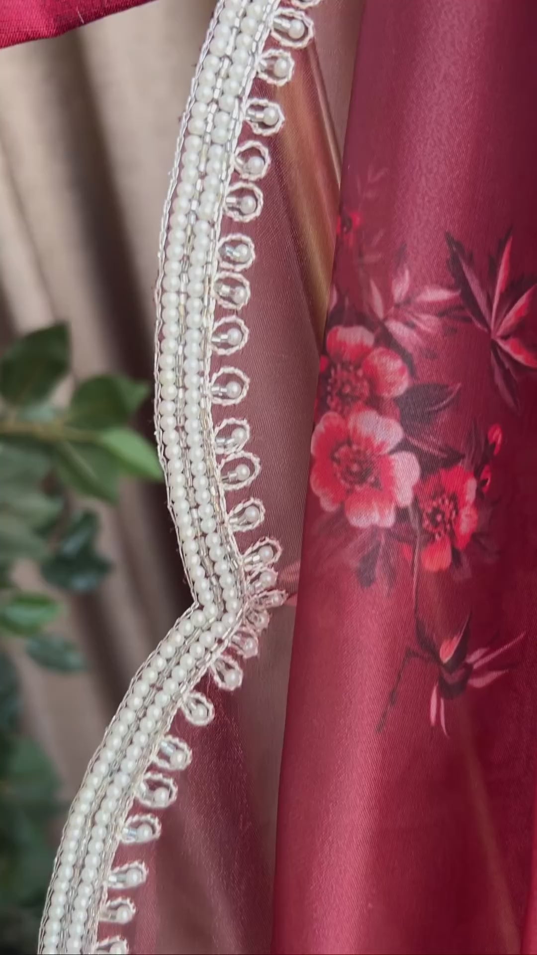 Deep maroon floral organza saree with hand worked blouse
