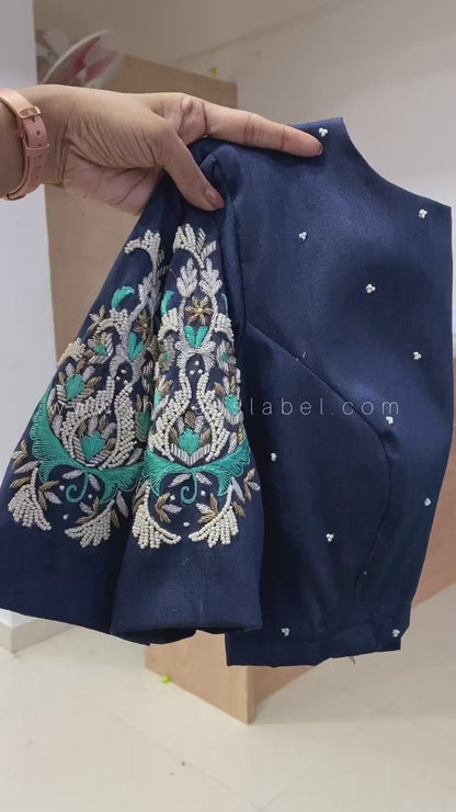 Green silk banarasi saree with paisley silver zari weave blouse