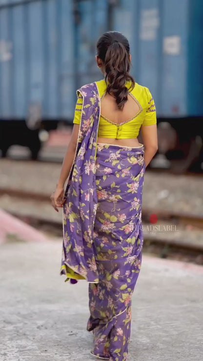 Blue floral tissue saree with lime hand work blouse