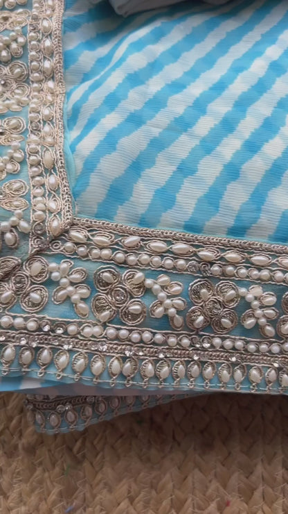 Aqua blue georgette saree with white handwork blouse