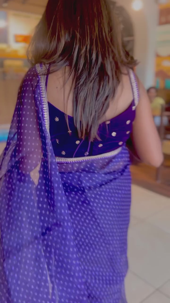 purple organza saree with purple velvet embroidered blouse