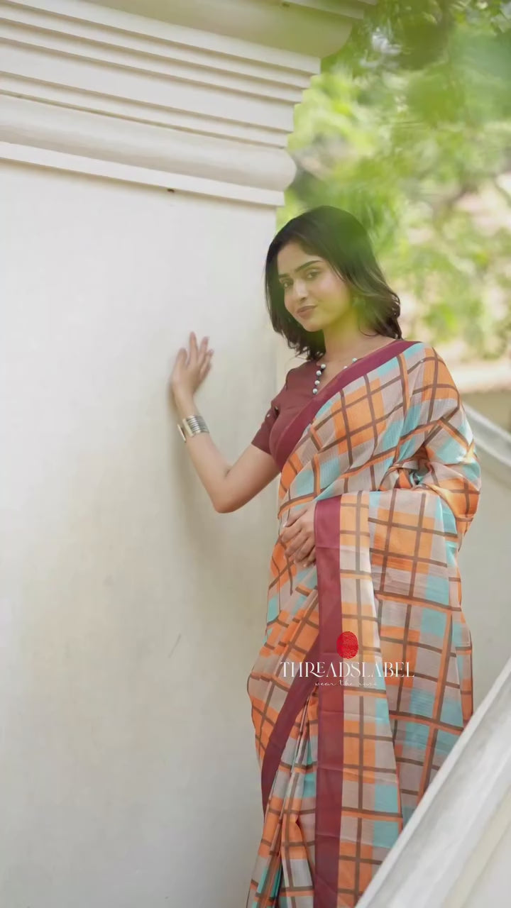 Multi checked kota saree with brown embroidery blouse