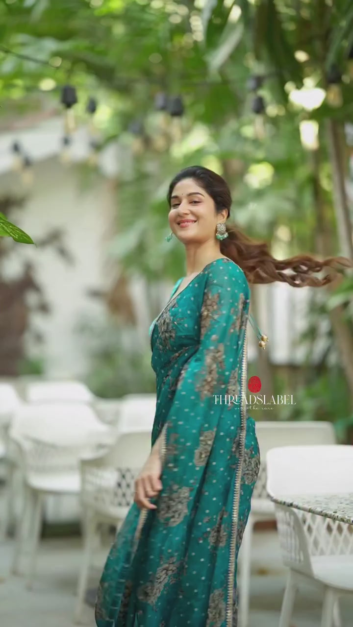 Peacock blue organza saree with velvet blouse