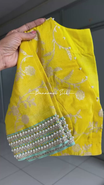 Blue glass tissue saree with yellow banarasi blouse