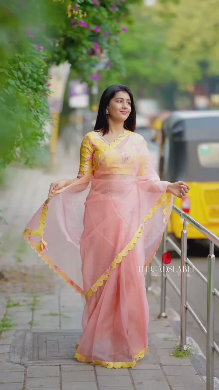 Peach organza saree with yellow floral hand work blouse