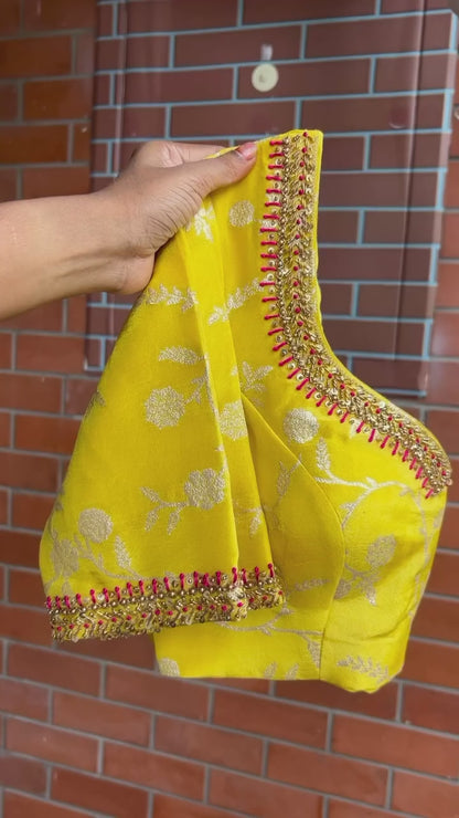 Pink stripped tissue saree with yellow floral hand work blouse