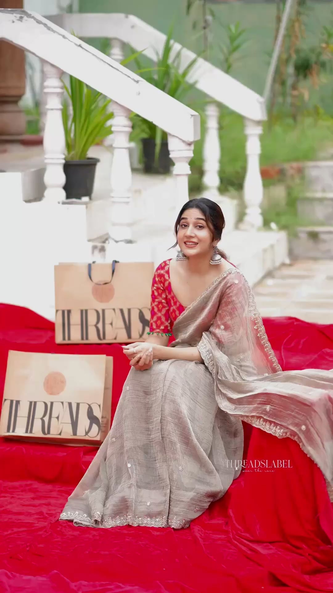 Grey tissue saree with red banarasi blouse
